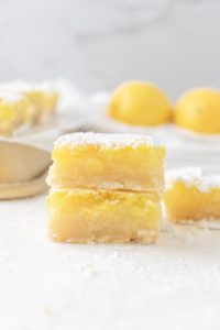 homemade lemon bars with a dusting of powdered sugar