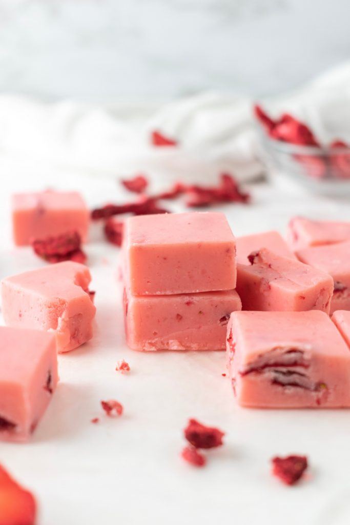 stacked pink fudge with strawberries