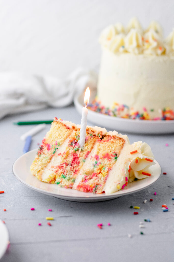 funfetti layer cake with a candle