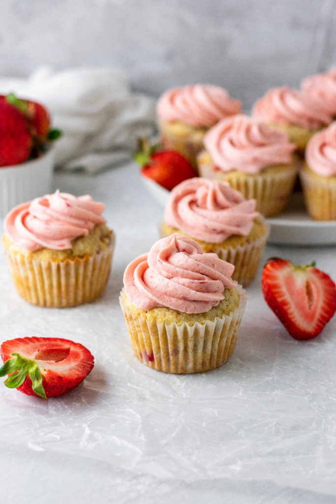 homemade strawberry cupcakes with fresh berries and strawberry frosting