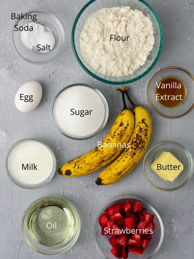 Ingredients needed: flour, baking soda, salt, egg, sugar, bananas, vanilla extract, milk, oil, strawberries, and butter 