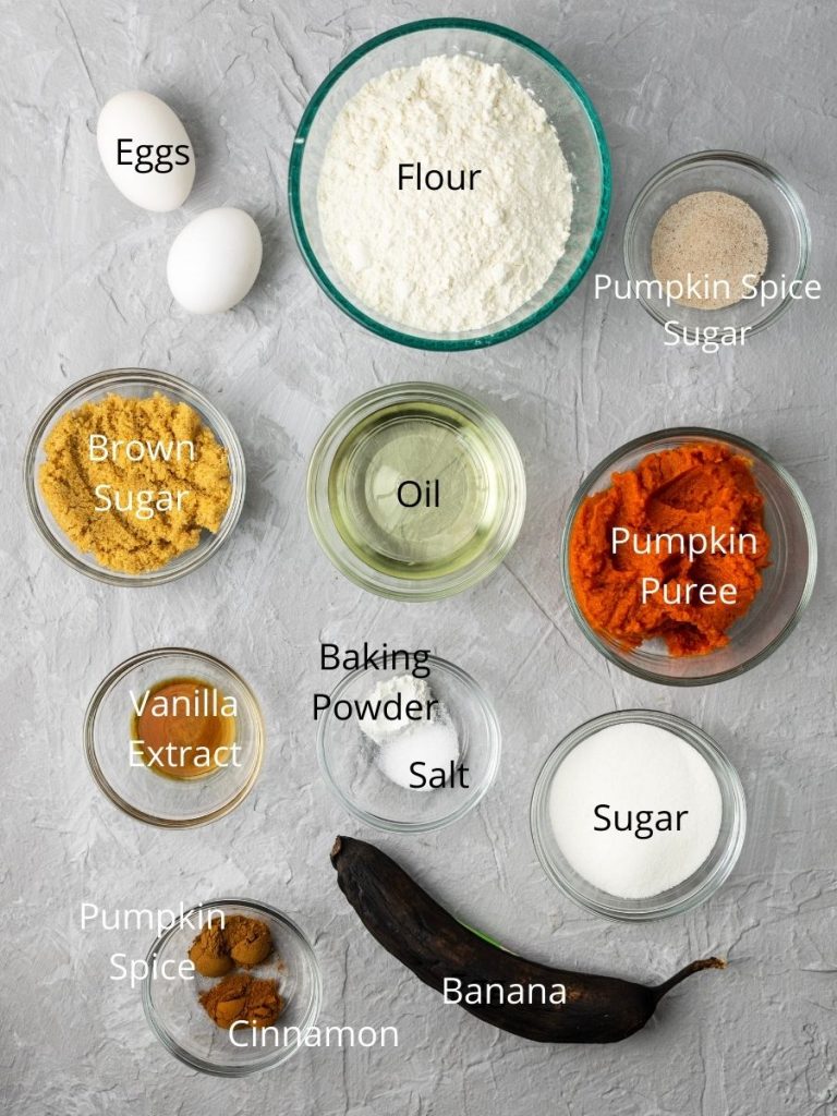 Ingredients needed to make pumpkin banana bread: eggs, flour, pumpkin spice sugar, brown sugar, oil, pumpkin puree, vanilla extract, baking powder, salt, sugar, pumpkin spice, cinnamon, banana