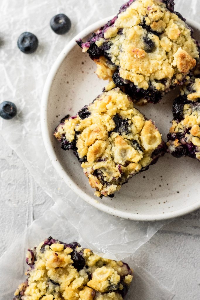 homemade blueberry bars with a shortbread crust and topping
