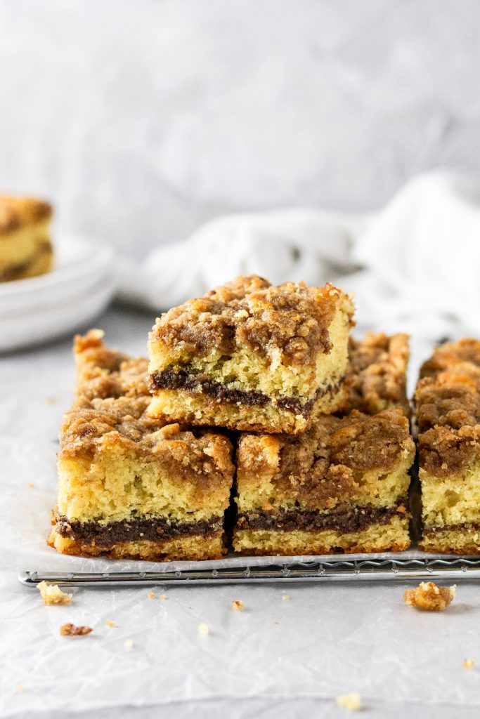 the best coffee cake stacked on top of each other showing off all of the cinnamon streusel and filling