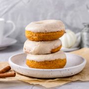 Stacked pumpkin donuts.