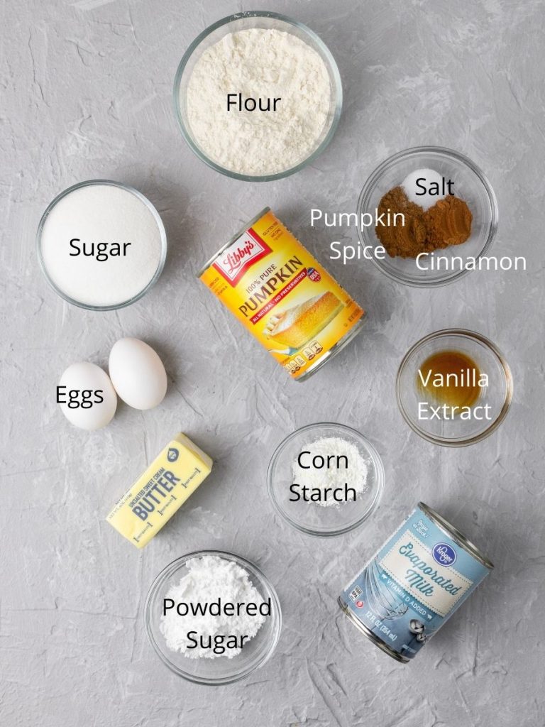 Ingredients in pumpkin pie bars: flour, salt, pumpkin spice, cinnamon, sugar, eggs, butter, pumpkin puree, vanilla extract, corn starch, powdered sugar, and evaporated milk