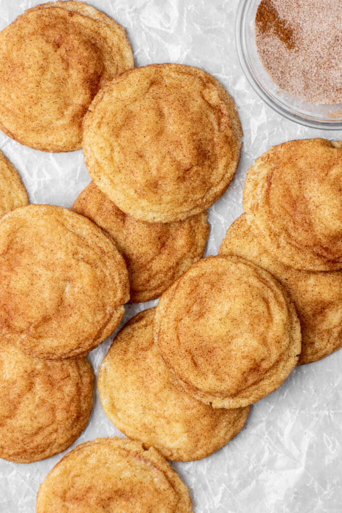 two dozen classic snickerdoodle cookies with a cinnamon sugar topping
