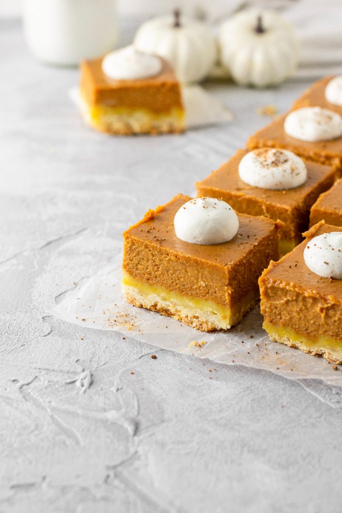 pumpkin pie bars baked in an 8x8-inch pan for a total of 9 bars