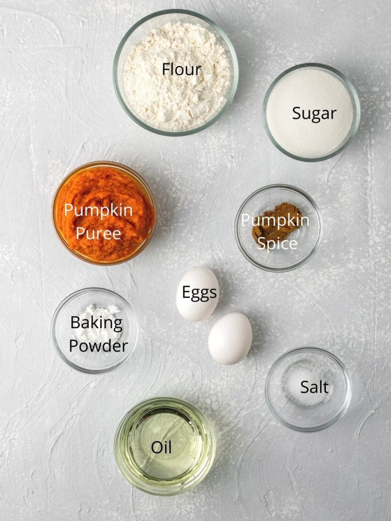 Ingredients needed to make pumpkin bars: flour, sugar, pumpkin puree, pumpkin spice, eggs, baking powder, oil, and salt