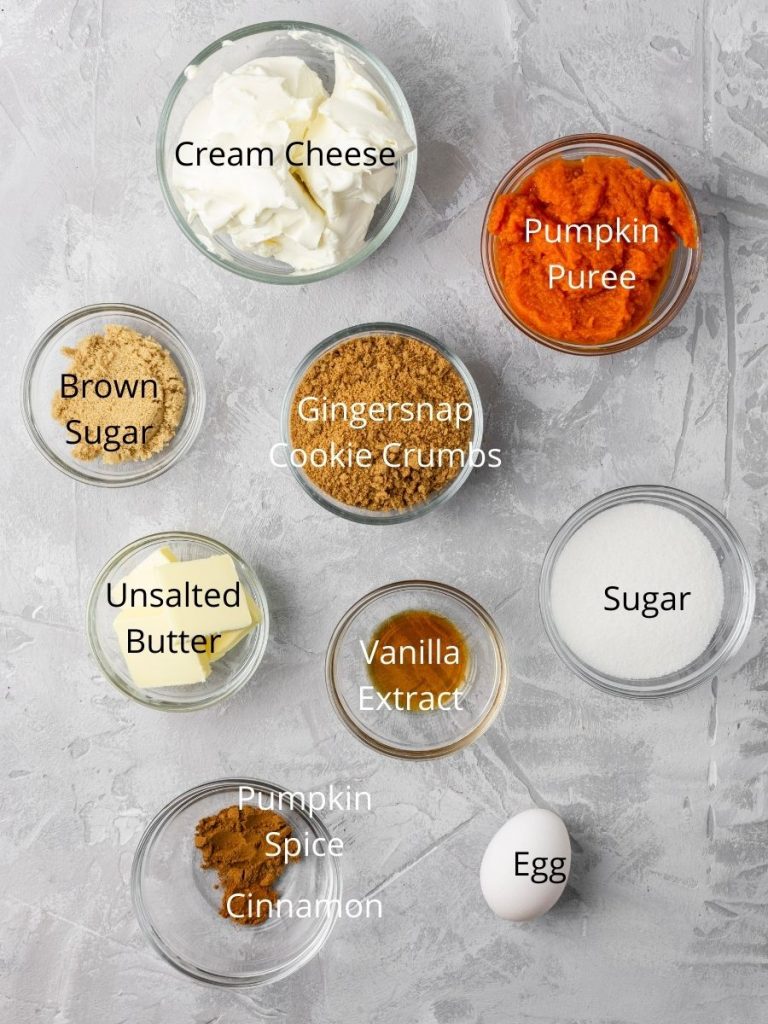 Ingredients needed to make cheesecake: cream cheese, pumpkin puree, brown sugar, gingersnap cookies, unsalted butter, vanilla extract, sugar, pumpkin spice, cinnamon, and egg