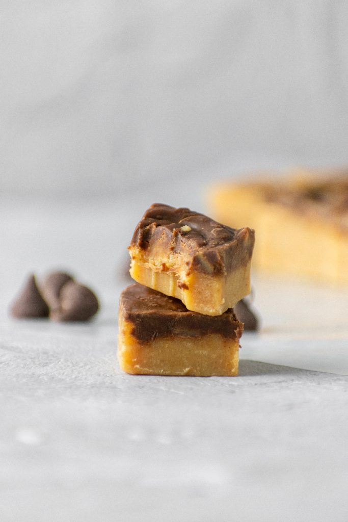 Chocolate peanut butter fudge stacked on top of each other.