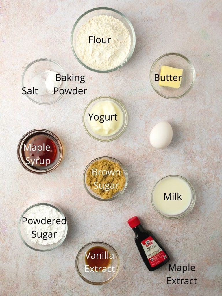 Ingredients needed for maple donuts: flour, baking powder, salt, butter, yogurt, egg, maple syrup, brown sugar, milk, powdered sugar, vanilla extract, maple extract