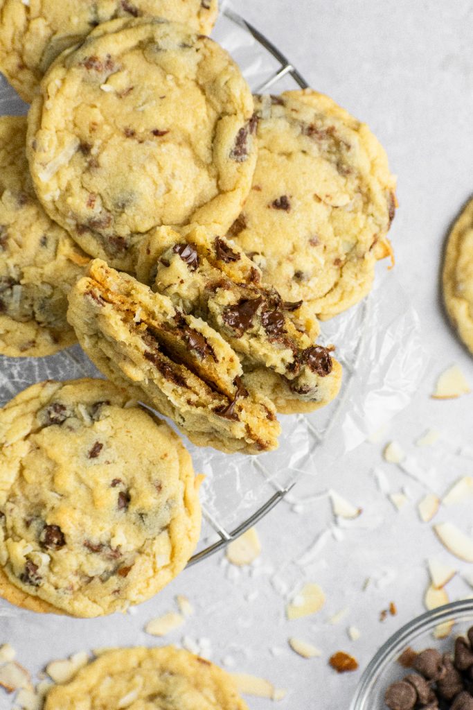 Ooey-gooey ceters of a chocolate chip cookie with shredded coconut and sliced almonds.