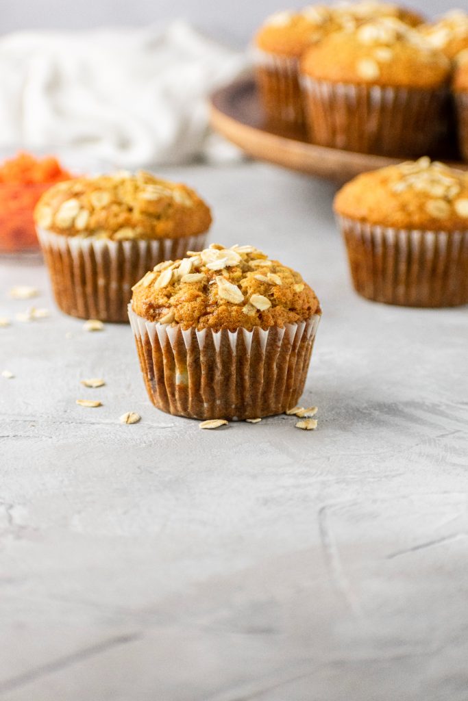 banana carrot muffins with oats baked on top
