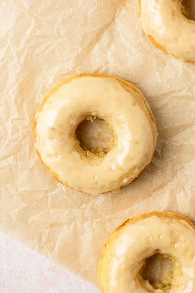maple donuts with a shiny maple glaze topping