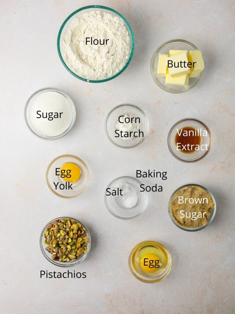 Ingredients needed: flour, butter, sugar, corn starch, vanilla extract, egg yolk, baking soda, salt, pistachios, and an egg.