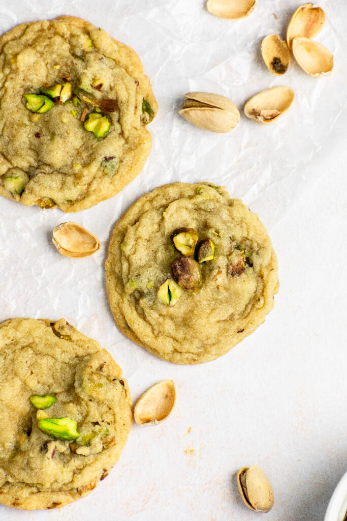Buttery cookies with green pistachios on top.