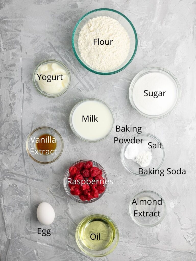 Ingredient list: flour, yogurt, sugar, milk, vanilla extract, baking powder, salt, baking soda, raspberries, egg, oil, and almond extract.