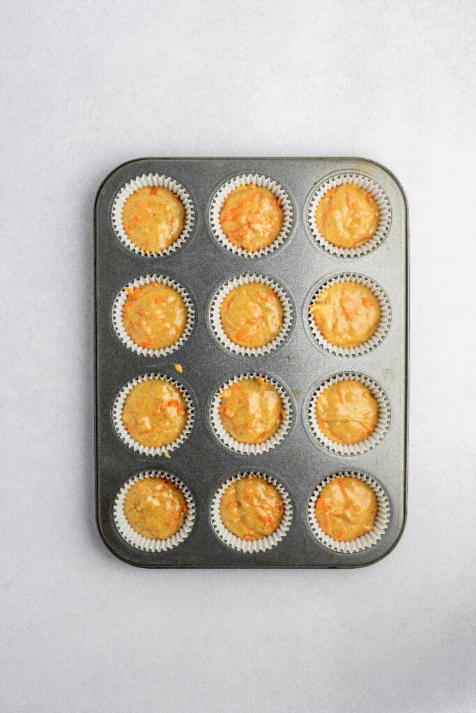 Cupcake pan filled with batter and ready to bake.