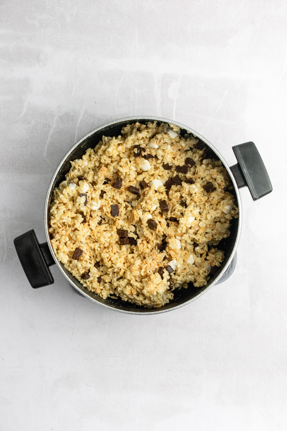 Lage pot with rice krispie mixture mixed together.