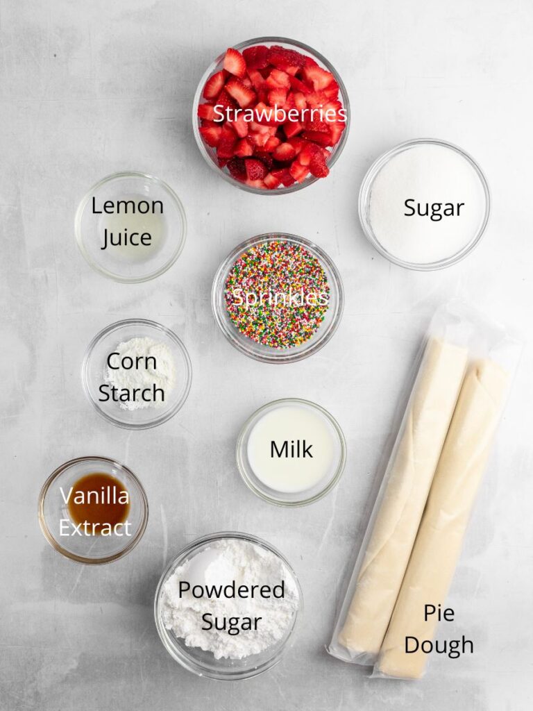 Ingredients needed: Strawberries, lemon juice, sugar, sprinkles, corn starch, milk, pie dough, vanilla extract, and powdered sugar.