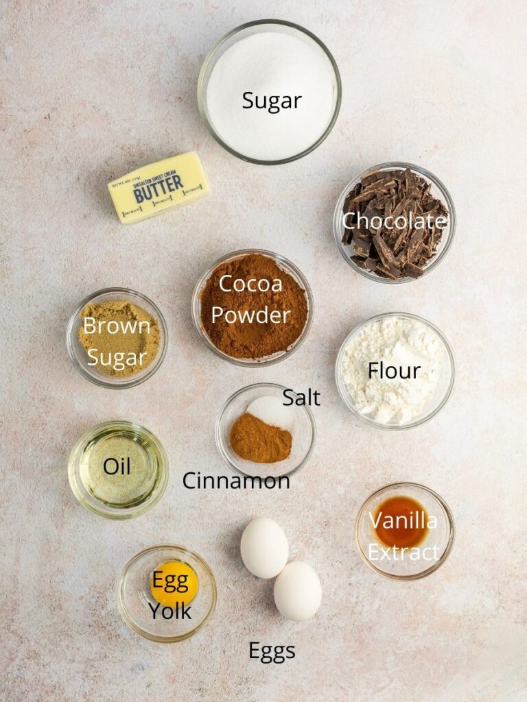 Ingredients needed: sugar, butter, chocolate, cocoa powder, brown sugar, flour, salt, cinnamon, oil, vanilla extract, egg yolk, and eggs.