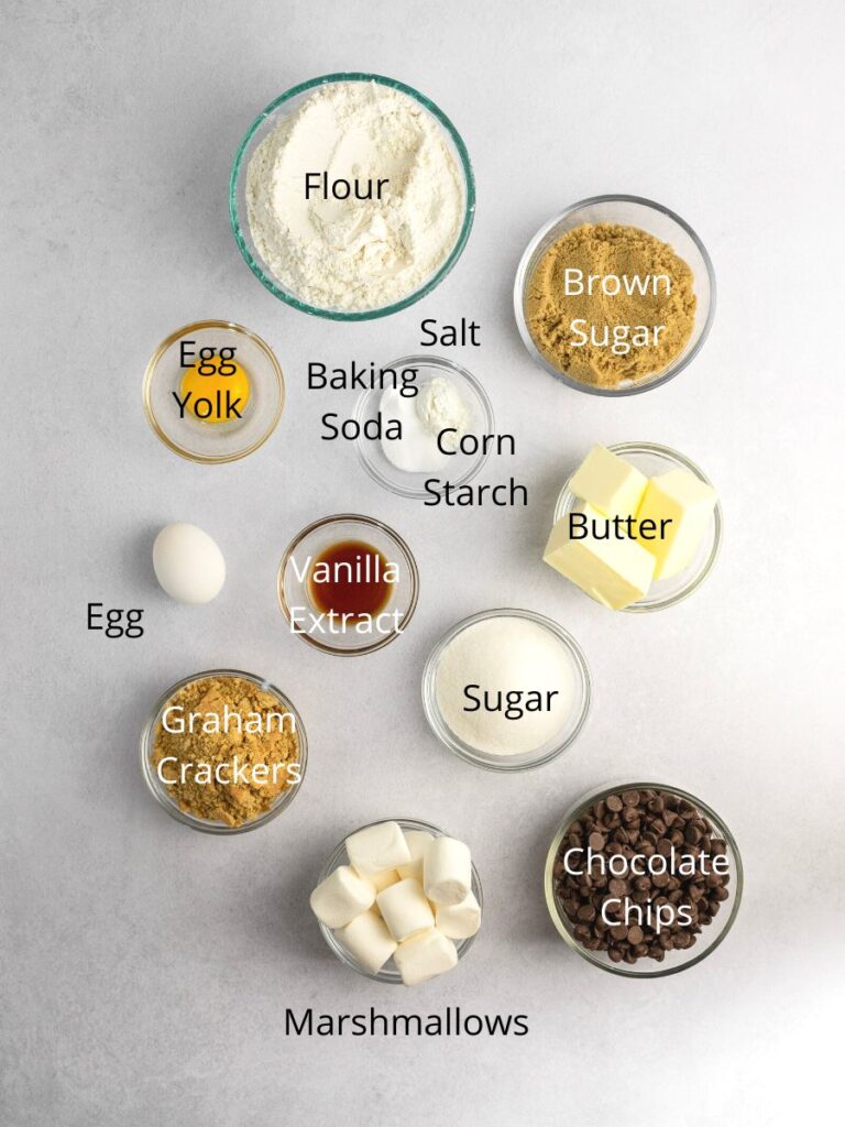 Ingredients: flour, brown sugar, salt, baking soda, corn starch, eggs, vanilla, sugar, graham crackers, chocolate chips, and marshmallows.