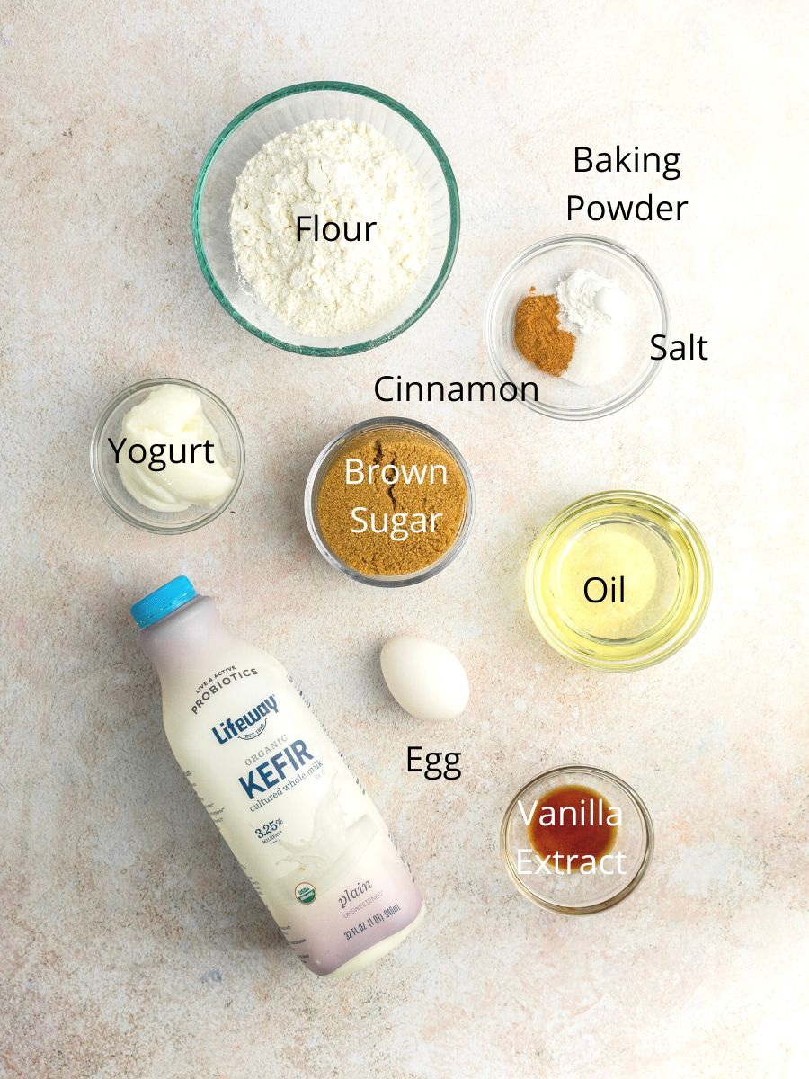 Ingredients needed: flour, baking powder, cinnamon, salt, yogurt, brown sugar, oil, egg, vanilla, and milk.