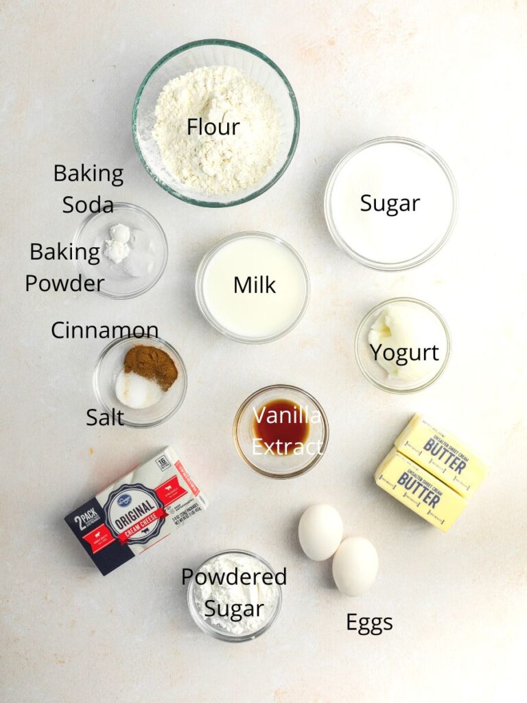 Ingredients needed: flour, sugar, baking soda, baking powder, milk, yogurt, cinnamon, salt, vanilla, butter, eggs, powdered sugar, and cream cheese.