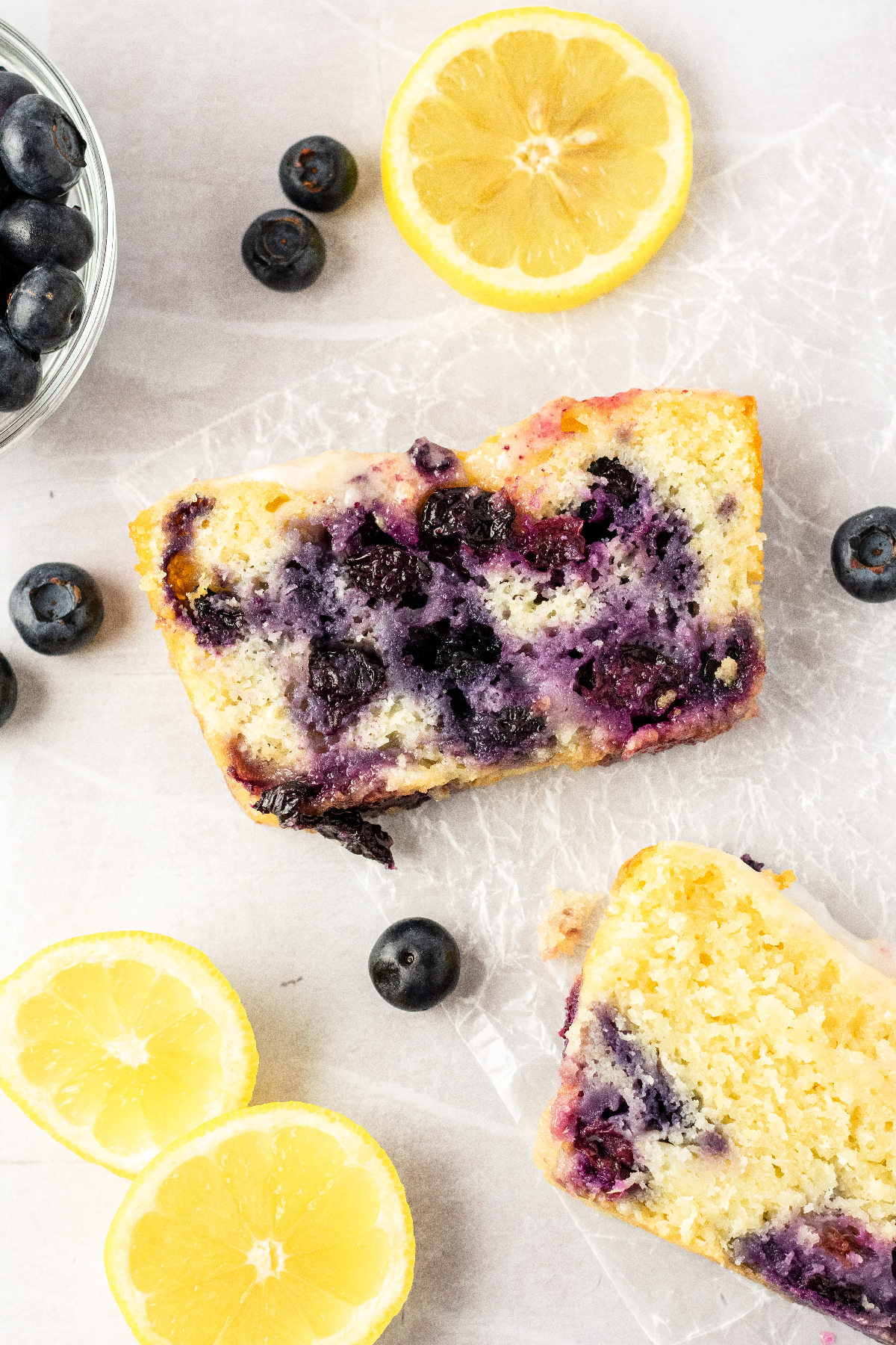 https://gingersnapsbakingaffairs.com/wp-content/uploads/2022/08/lemon-blueberry-bread-with-glaze-slice-1200px.jpg