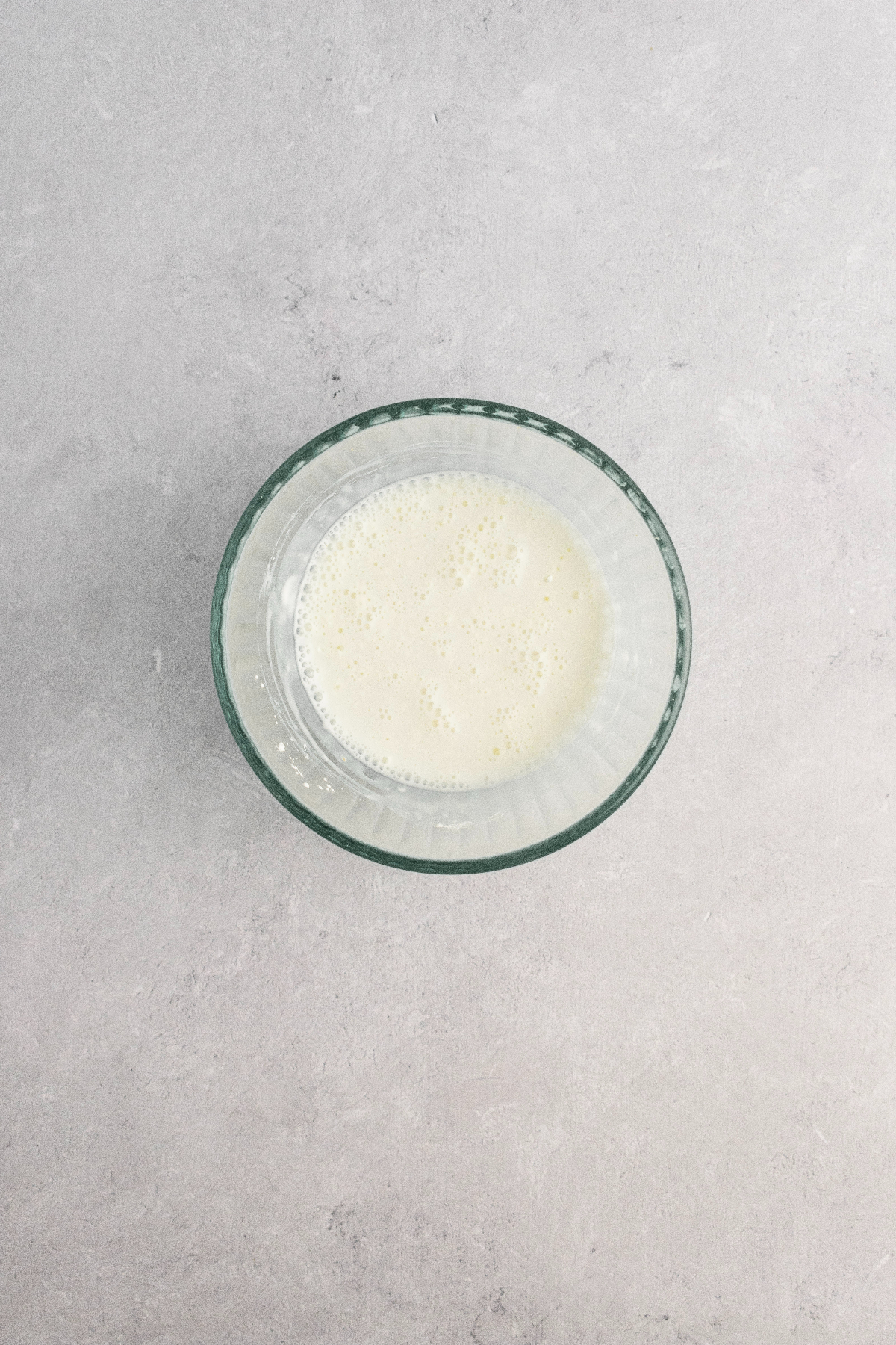 Corn starch milk mixture in a small glass bowl.