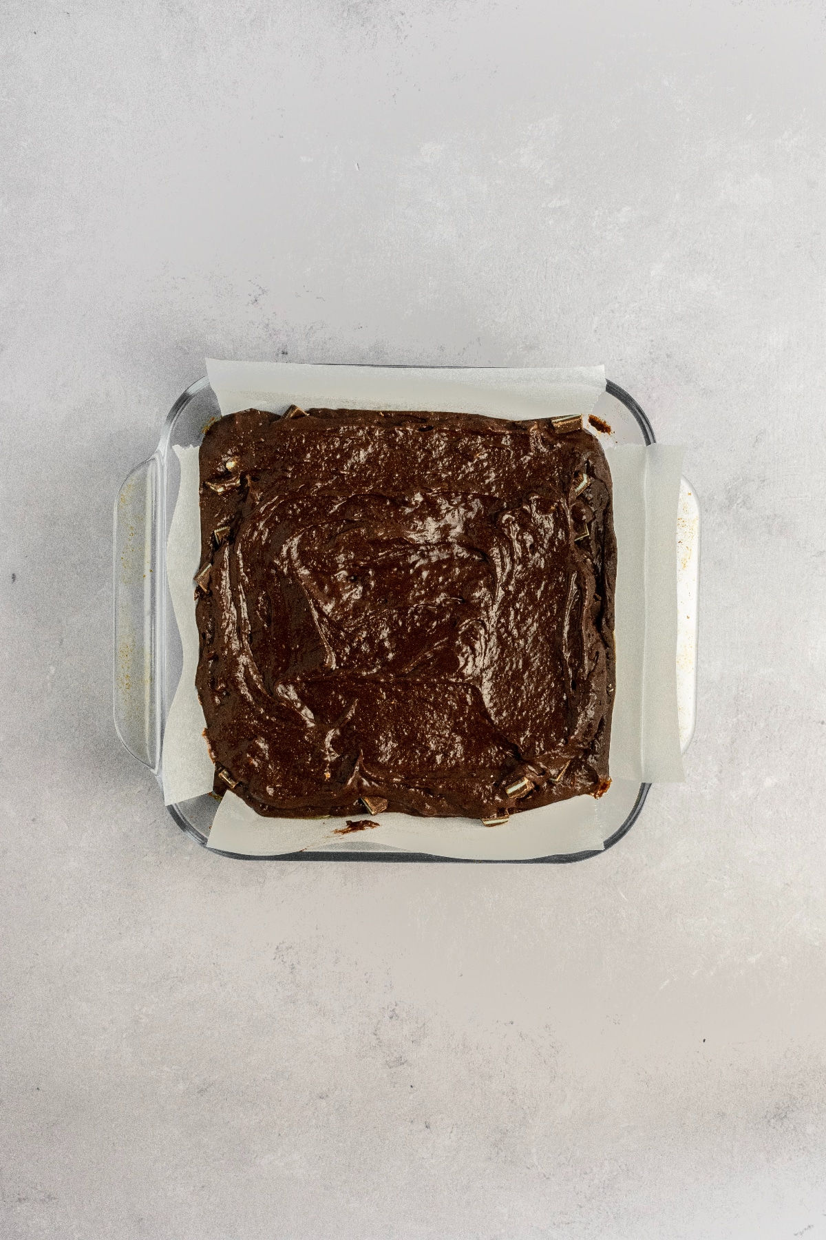 A baking pan full of brownie batter ready to bake.
