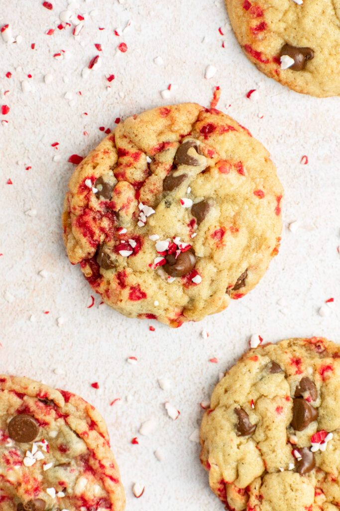 Candy cane chocolate chip cookies with candy cane bits on the side.