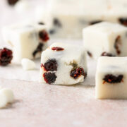Cranberry white chocolate fudge on parchment paper.