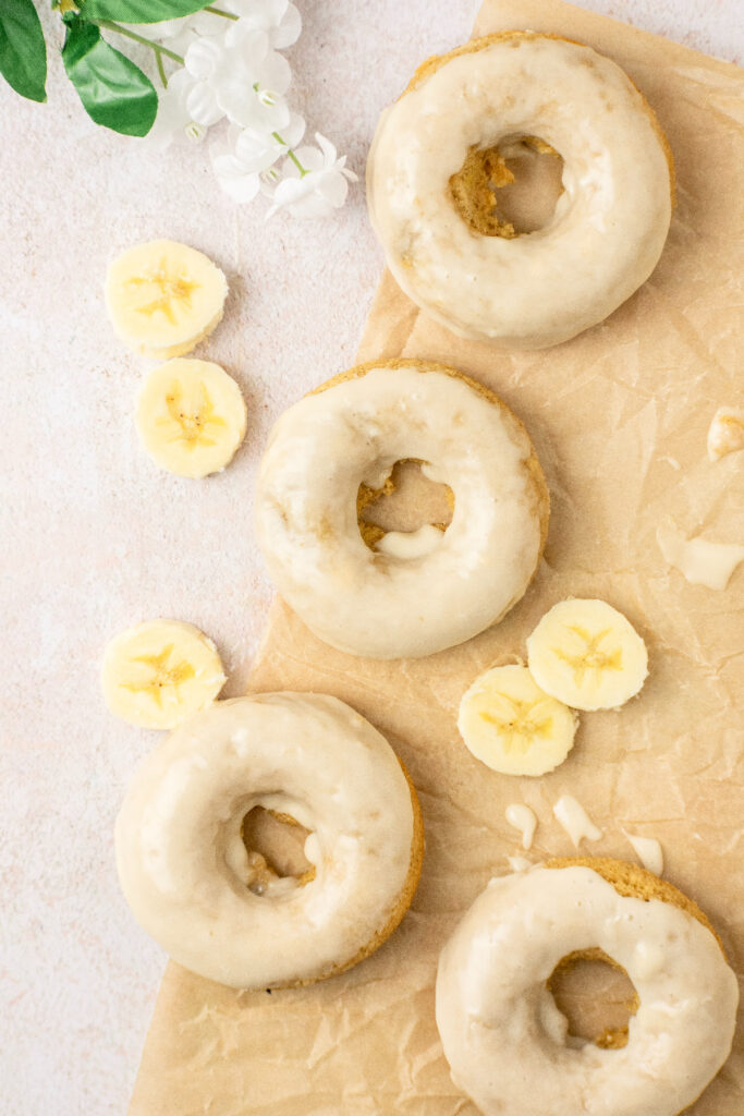 Baked donuts with fresh bananas and a vanilla glaze.