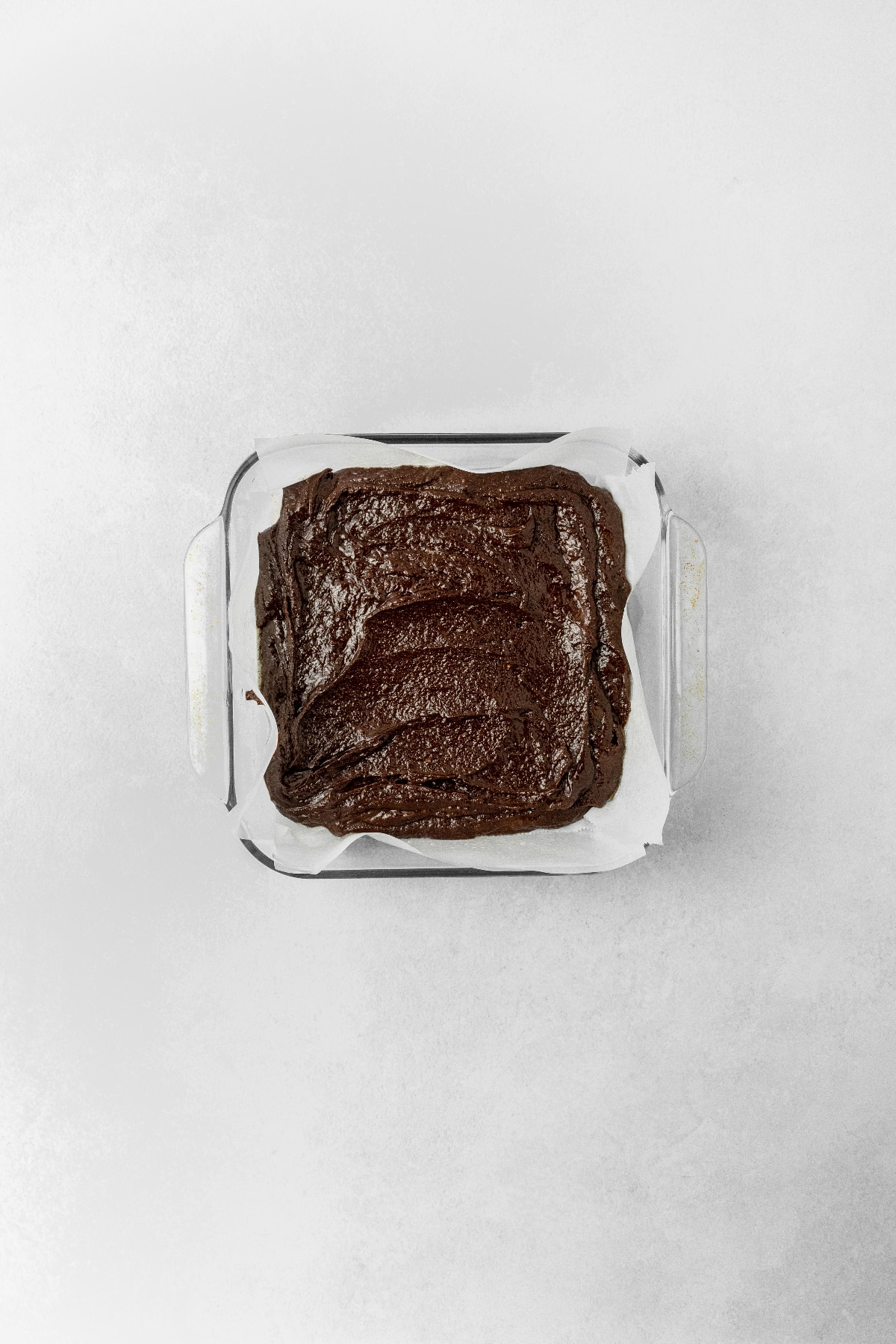 Brownies in a square pan ready to bake.