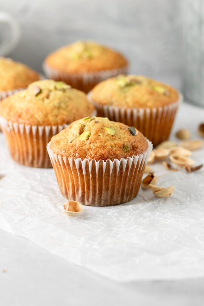 Super delicious muffins with real pistachios baked on top and in the batter.