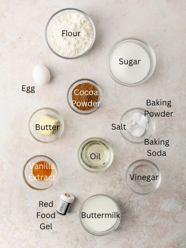 Ingredients needed: flour, sugar, egg, cocoa powder, baking powder, baking soda, salt, butter, oil, vinegar, vanilla, food coloring, and butermilk.