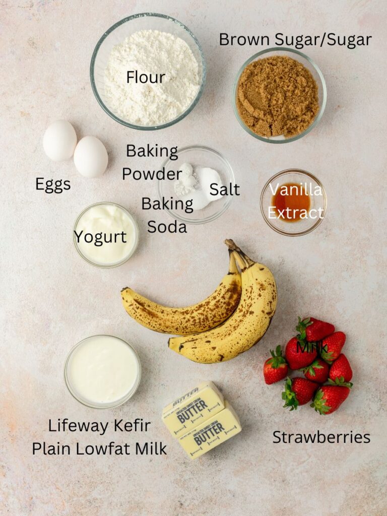 Ingredients needed: flour, brown sugar, sugar, eggs, baking powder & soda, salt, vanilla, yogurt, bananas, strawberries, butter, and milk.