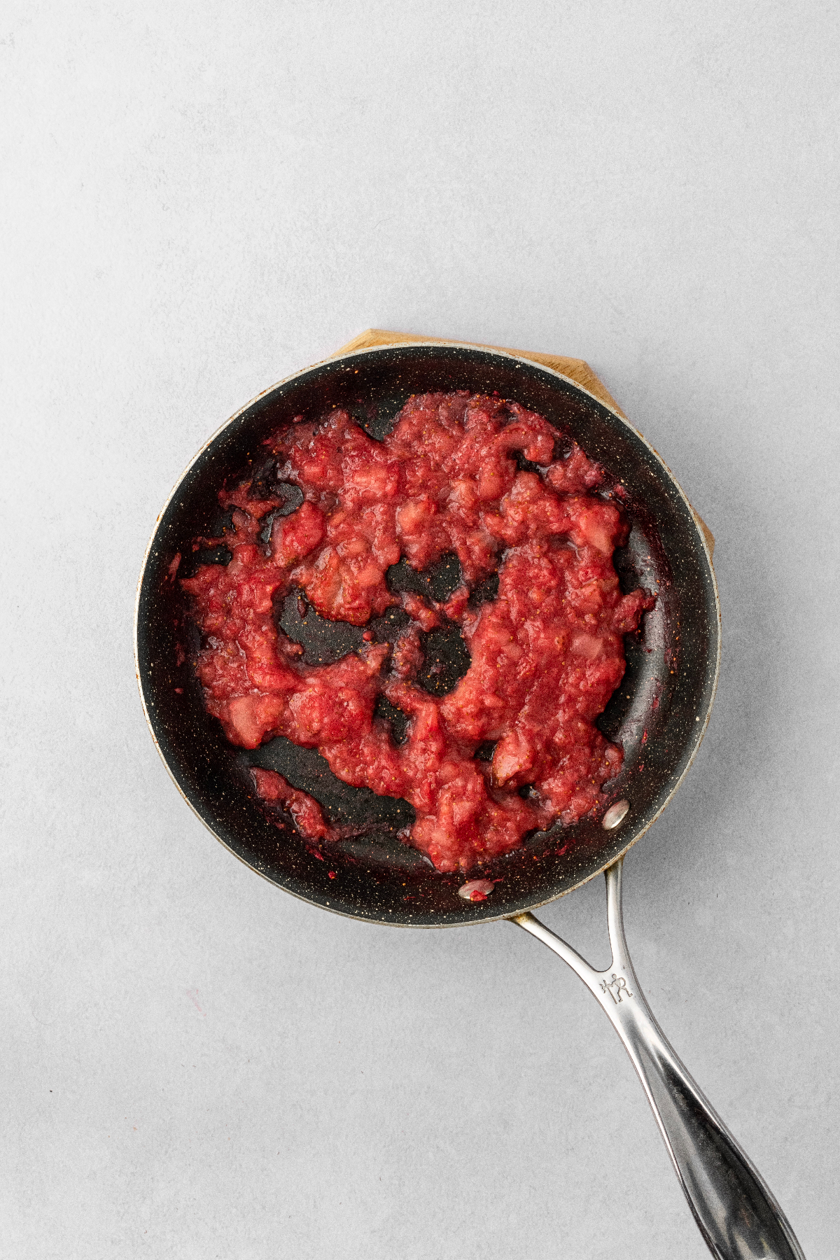 Strawberry puree in a saucepan.