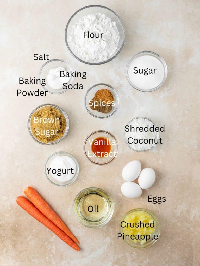Ingredients needed: flour, salt, baking powder, baking soda, sugar, spices, brown sugar, vanilla, coconut, yogurt, eggs, oil, carrots, and pineapple.