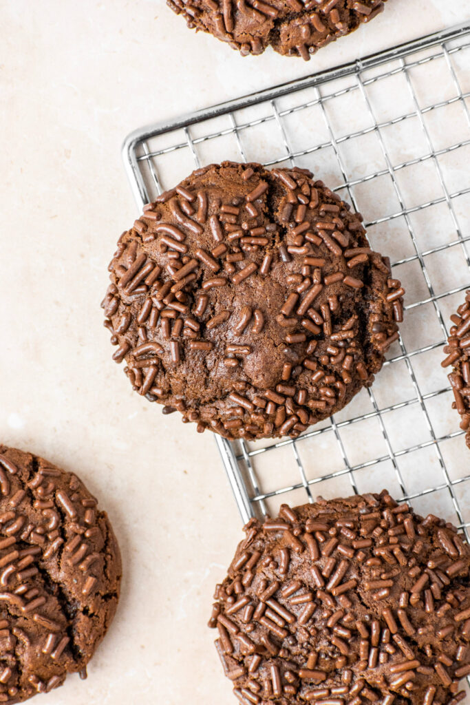 Chocolate cookies with chocolate sprinkles baked on top.