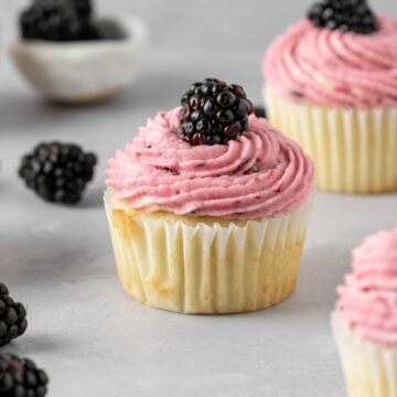 Blackberry cupcakes with fresh blackberries.