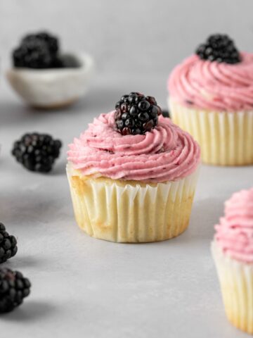 Blackberry cupcakes with fresh blackberries.