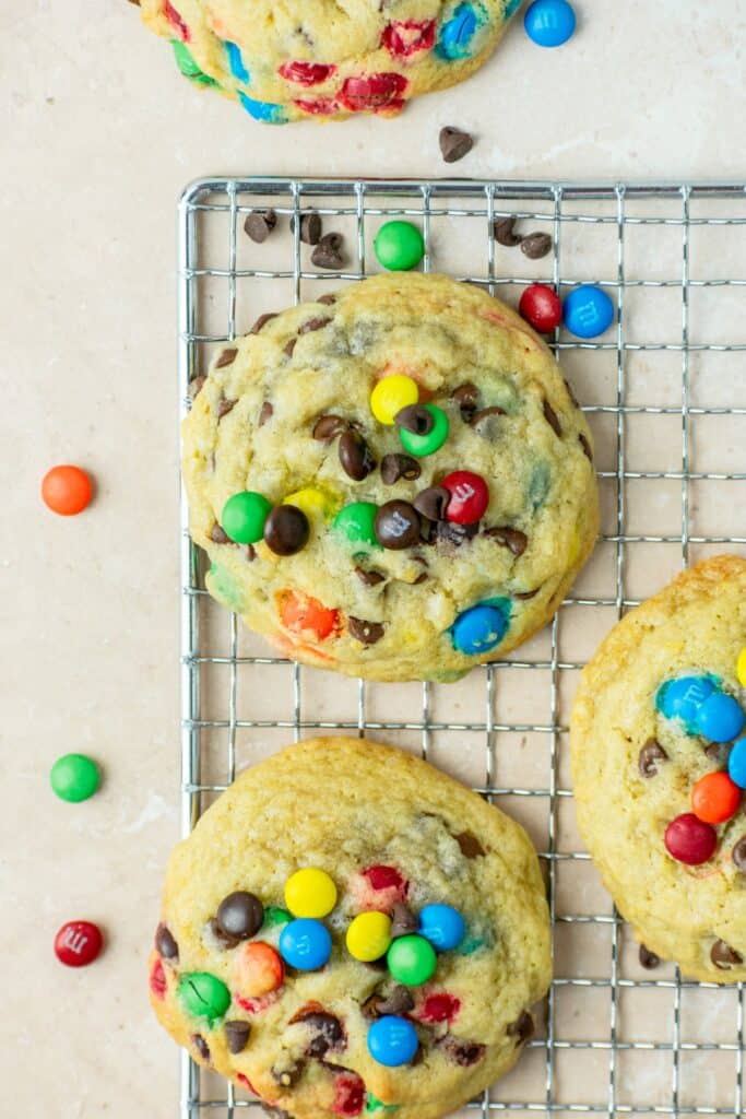 Mini m&m cookies with lots of m&ms all around them.