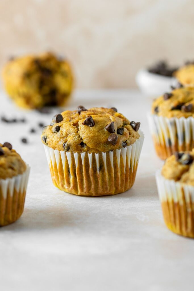 Banana pumpkin muffins with mini chocolate chips on top.