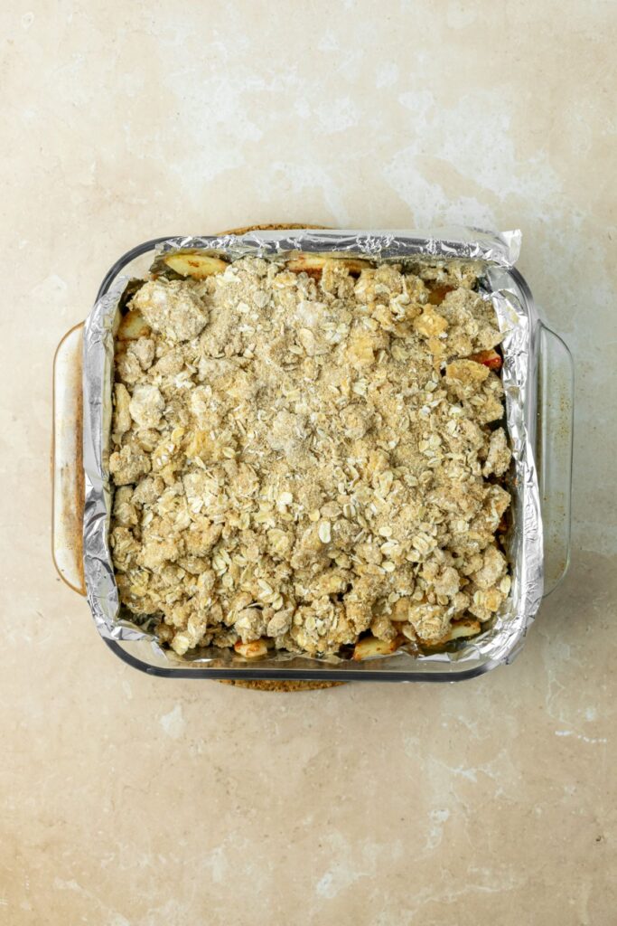 Streusel oat topping in a baking pan.