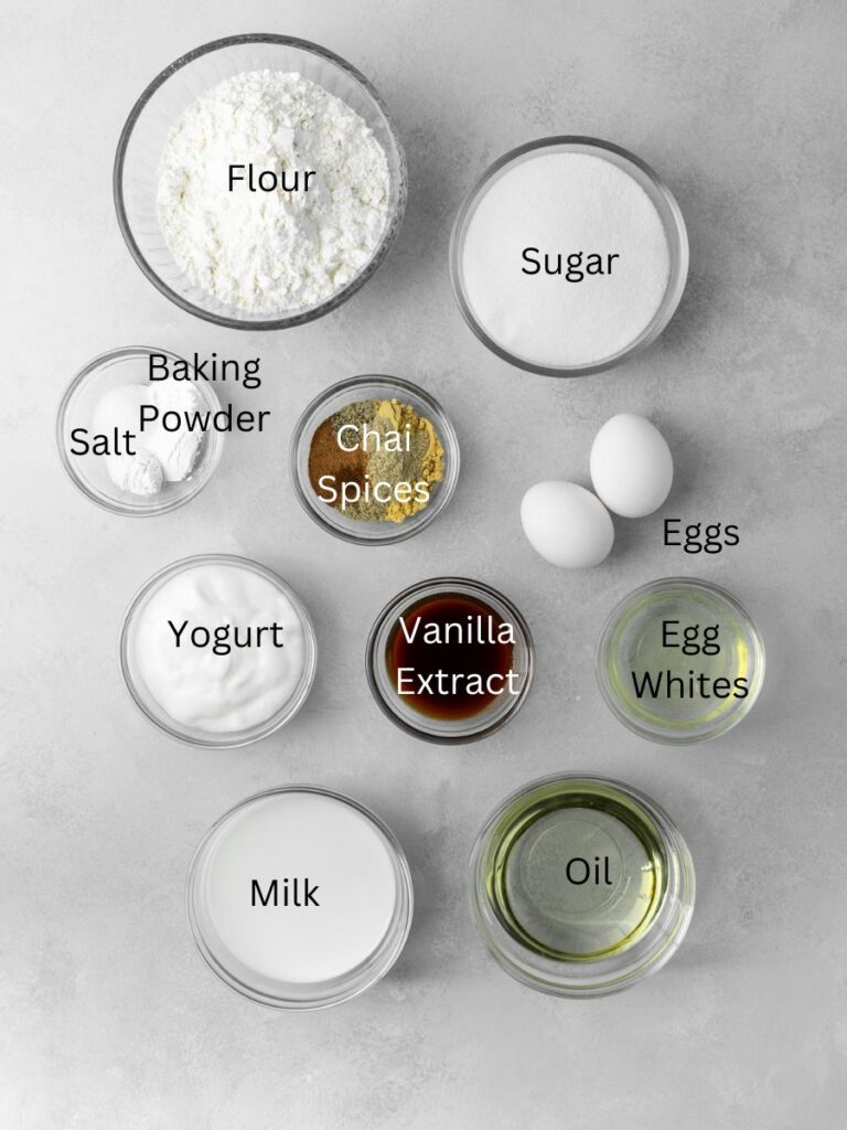 Ingredients: flour, sugar, baking powder, salt, chai spices, eggs, egg whites, yogurt, vanilla, milk, and oil.