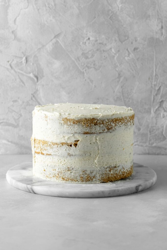 A layered cake with a crumb coat on the outside.