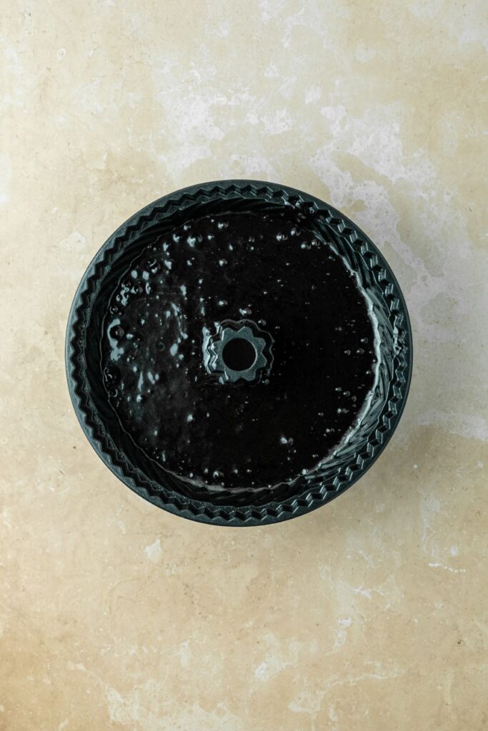 Dark chocolate cake batter in a bundt pan.